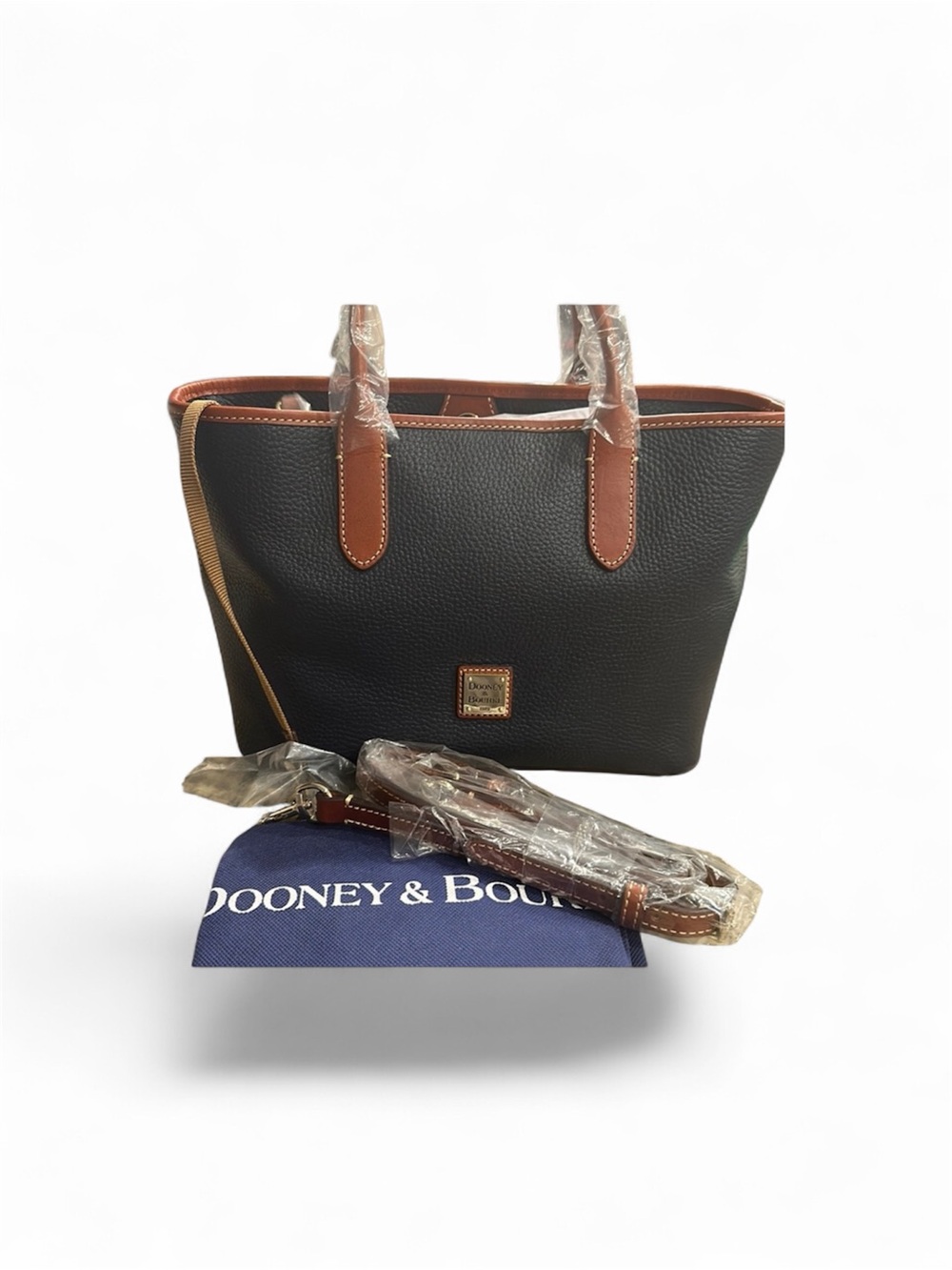 Dooney & Bourke Black Pebble Leather Tote with Brown Trim and Gold Plaque